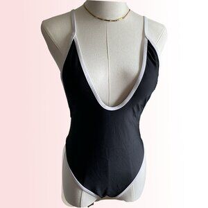 Black and white one piece swimsuit with high leg and low back NWOT